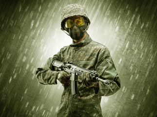 Armed soldier standing in rainy weather