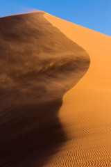 Africa, Namibia, Namib-Naukluft National Park. Blowing sand on dune.