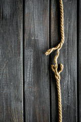 stress concept with breaking rope on wooden background top view mockup