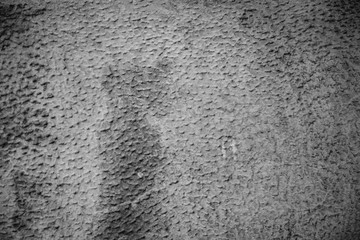 Cement plastered stone wall. Texture, design, background.