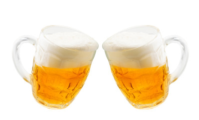 Two glasses of beer clink against each other on a white, isolated.
