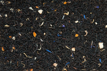  tea leaves on wooden background