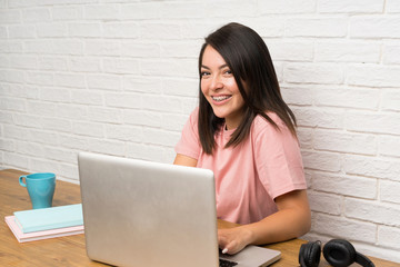 Young Mexican woman with a laptop