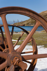 UK Territory, South Georgia Island, Ocean Harbor. View of abandoned shipwreck through rusty whaling machinery. 