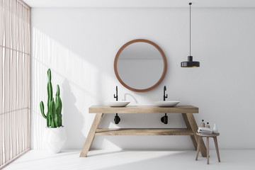White bathroom with double sink and mirror