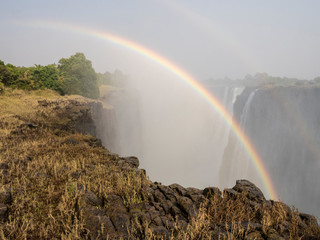 Africa, Zimbabwe, Victoria Falls. Rainbow over waterfall.