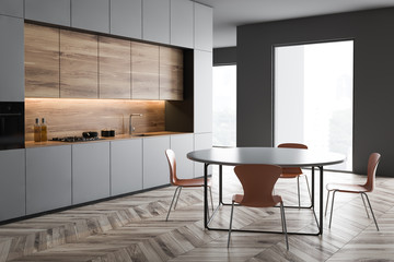 Gray kitchen corner with round table