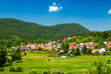 Fototapeta na wymiar Beautiful countryside landscape of town of Lokve in Gorski kotar, Croatia, in summer, panoramic view