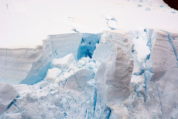 Fototapeta na wymiar Antarctica. Lemaire Channel. Glacier with crevasses.