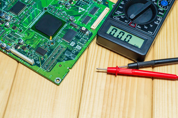 Services for the production of electronics and repair on a wooden background.