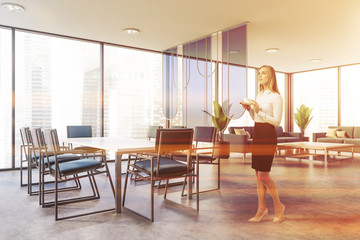Fototapeta premium Woman in modern conference room with lounge