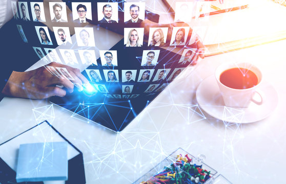 Hand of man with tablet using social media