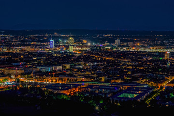 Fototapeta na wymiar Aerial panoramic cityscape view with bright lights in night Munich
