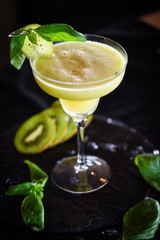 kiwi cooler cocktail with fresh basil & ice
