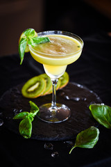 kiwi cooler cocktail with fresh basil & ice