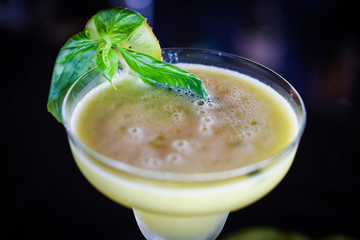 kiwi cooler cocktail with fresh basil & ice