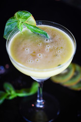 kiwi cooler cocktail with fresh basil & ice