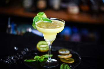 kiwi cooler cocktail with fresh basil & ice