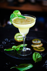 kiwi cooler cocktail with fresh basil & ice