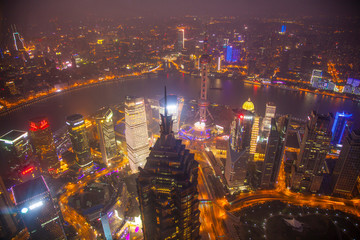 Fototapeta na wymiar China, Shanghai. Downtown buildings at night. Credit as: Jim Zuckerman / Jaynes Gallery / DanitaDelimont.com