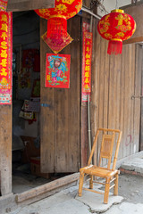 Door of a traditional house decorated with lanterns and red posters, Pengzhen, Chengdu, Sichuan Province, China