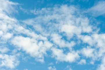Blue sky with white tiny clouds in summer season.