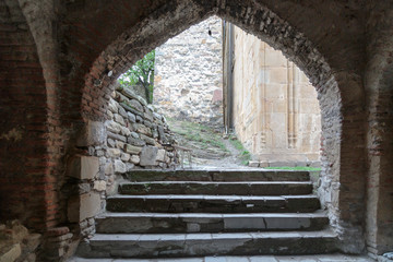 Fototapeta na wymiar Georgia, Aragvi. An archway in the Ananuri Castle Complex.