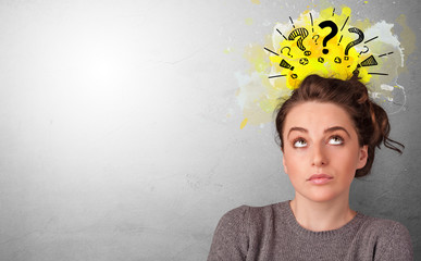 Business person looking for new idea with question marks