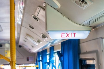 Emergency exit light sign on bus direction sign for safety when have any situation.  EXIT security...