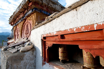 India, Jammu & Kashmir, Ladakh, Lamayuru on the Srinagar-Kargil-Leh road prayer wheels and a decorated chorten.