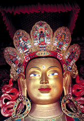 Fototapeta premium Asia, India, Ladakh, Thikse. The Buddha at Thikse Gompa in Ladakh, India, has an elaborate painted headdress.