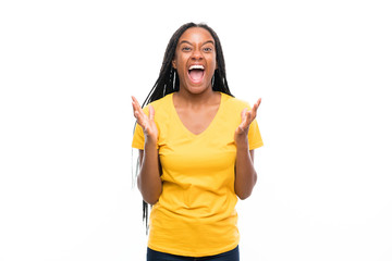 African American teenager girl with long braided hair over isolated white background unhappy and frustrated with something