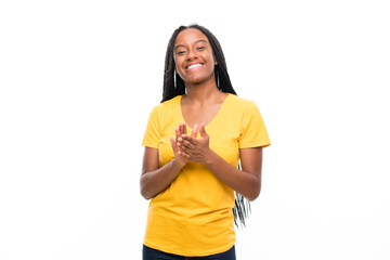 African American teenager girl with long braided hair over isolated white background applauding