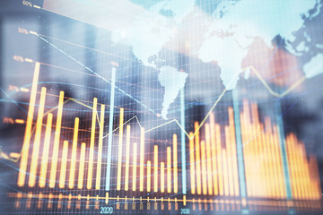 Stock and bond market graph and world map with trading desk bank office interior on background. Multi exposure. Concept of international finance
