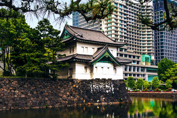 Tokyo, Japan. Imperial Palace, Edo Castle, with guard house and moat surrounded by modern city buildings