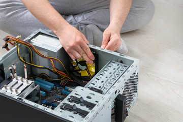 Service electronics and computers concept. Computer engineer is repairing CPU. Computer repair.