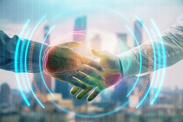 Multi exposure of human brain drawing on city view background with handshake. Concept of brainstorm