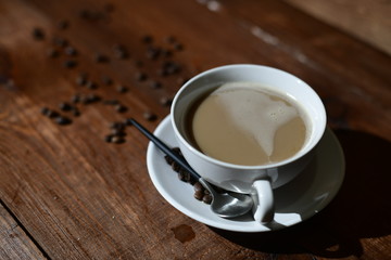 cup of coffee on wooden table