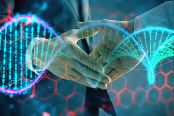 Multi exposure of DNA hologram on abstract background with two men handshake. Concept of bioengineering