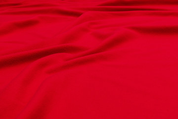 Red crumpled blanket, texture, background, top view