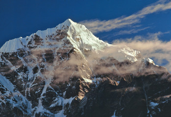 Asia, Nepal, Sagarmatha NP. Wispy sunrise clouds glance off Tawache Peak, Sagarmatha NP, a World Heritage Site, Nepal. © Ric Ergenbright/Danita Delimont