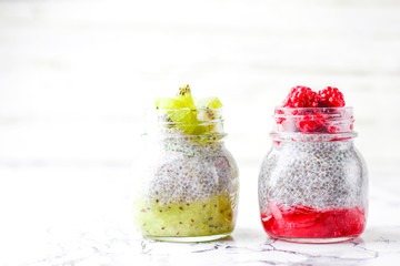 Chia pudding with berries ,raspberry sauce,kiwi sauce,blackberry sauce and frozen raspberries and blackberries and kiwi slices, healthy breakfast, vitamin snack, diet and healthy eating
