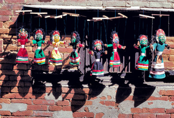 Fototapeta na wymiar Colorful puppets tempt shoppers at the market in Kathmandu, a World Heritage Site, Nepal.