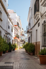 Fototapeta na wymiar Typical old town street in Marbella, Costa del Sol, Andalusia, Spain, Europe