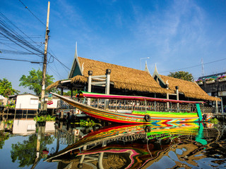 Fototapeta na wymiar Southeast Asia, Thailand, Bangkok, Boat in reflection in back canals