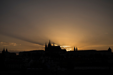 Fototapeta na wymiar Silhouette of the St. Vitus Cathedral, Prague (Hradcany) Castle and Mala Strana district in Prague, Czech Republic, at sunset. Copy space.