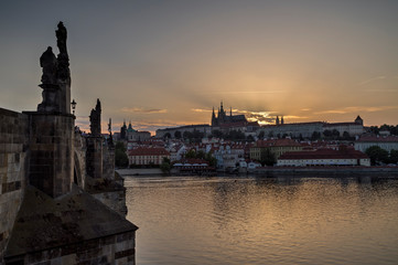 Fototapeta premium View of the Charles Bridge (Karluv most) over Vltava River, Mala Strana district and Prague (Hradcany) Castle in Prague, Czech Republic, at sunset. Copy space.