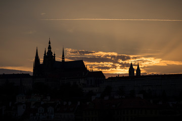 Obraz premium Silhouette of the St. Vitus Cathedral, Prague (Hradcany) Castle and Mala Strana district in Prague, Czech Republic, at sunset. Copy space.