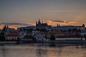 View of the Vltava River, Mala Strana district and Prague (Hradcany) Castle in Prague, Czech Republic, at sunset. Copy space.