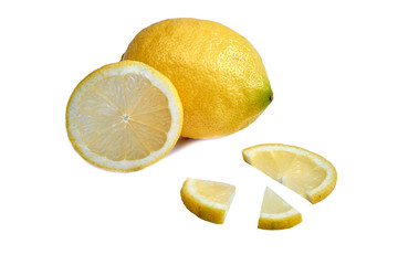 whole yellow lemon along with a cut of the same and an exploded view of a slice.